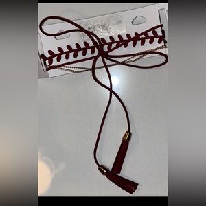 This stylish maroon bohemian headband doubles as a choker